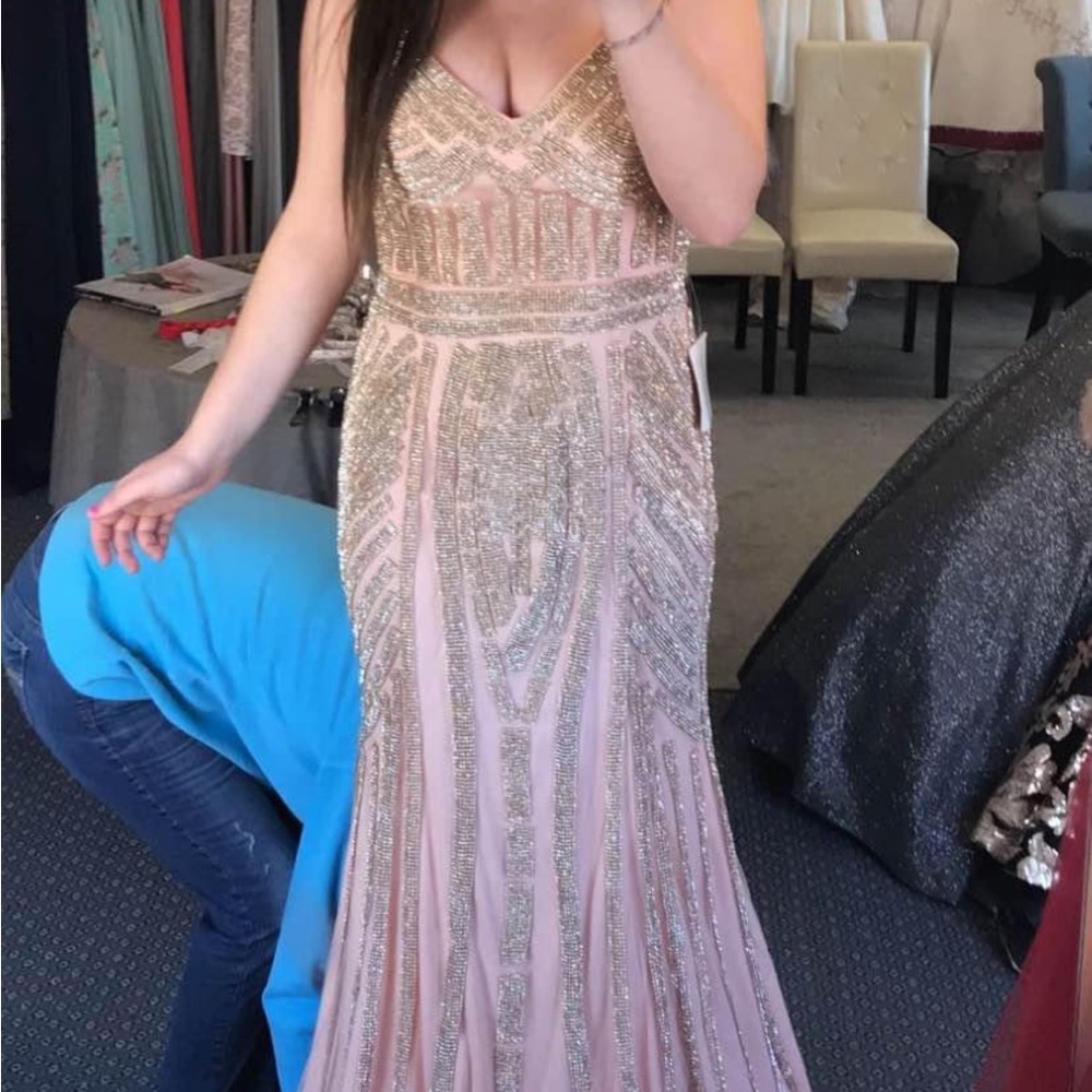 Affordable prom dress. Worn once to my prom, no alterations were made size 10
